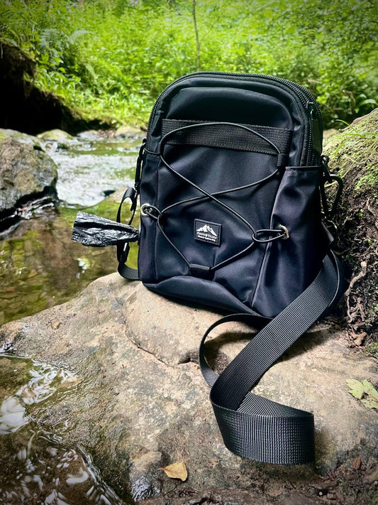 Tactical dog walking bag front view with adjustable straps and multiple compartments
